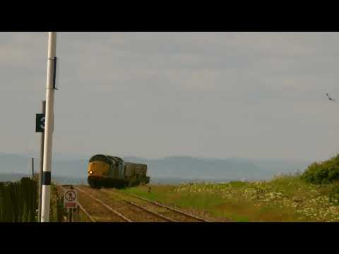 Drs 37605 & 603 passing Harrington with a flask train