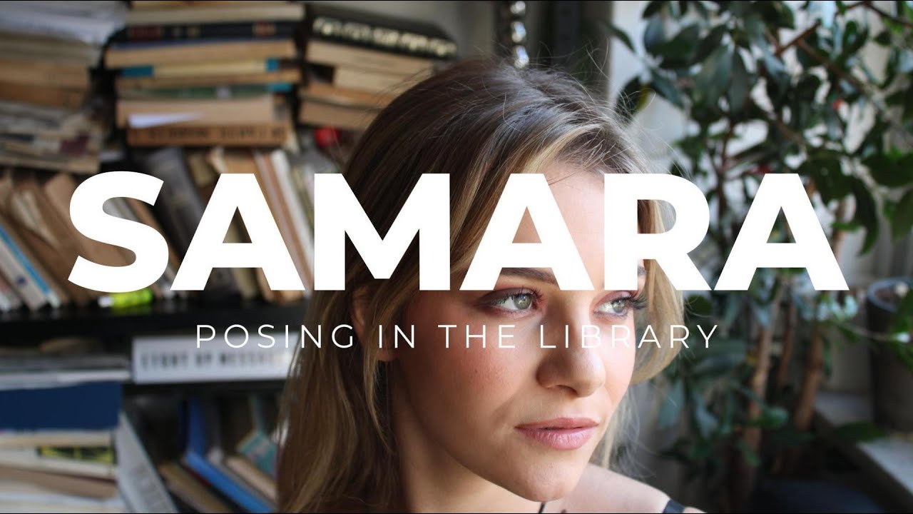 Sam posing naked in the library backstage. EDSA Content