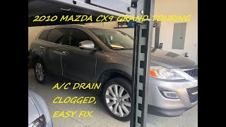 Mazda CX9 Grand Touring, A/C drain is clogged. Easy repair.