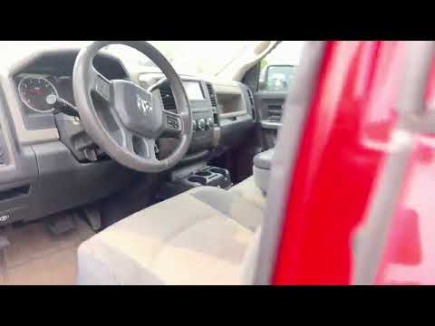 2012 Ram 1500 4WD Quad Cab 6.4 Ft Box ST in Red for sale at Finch Chrysler Dodge Jeep Ram Ltd in London, ON