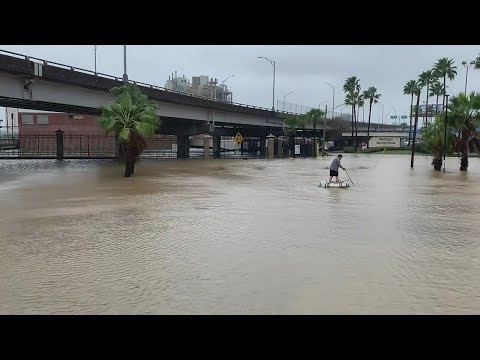 Florida man makes raft out of beer kegs in flooded Downtown Jacksonville during Nicole