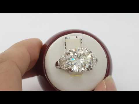 6.27 ct platinum round cut & haft moon diamond 3 stone ring.
