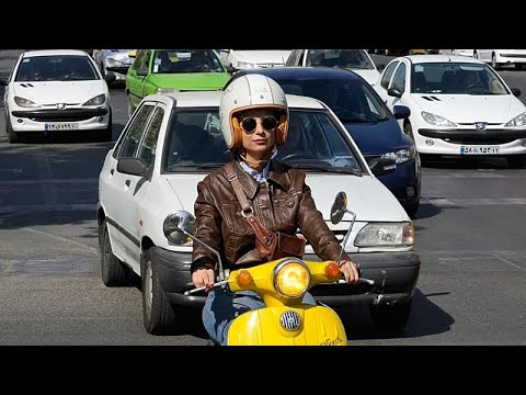 More women ride motorbikes in Tehran, testing Iran’s legal limits