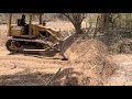 CAT D4E With A D5B Blade Pushing Dirt