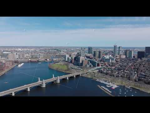 Aerial panoramic view of Longfellow Bridge over Charles river, busy multilane road on waterfront and