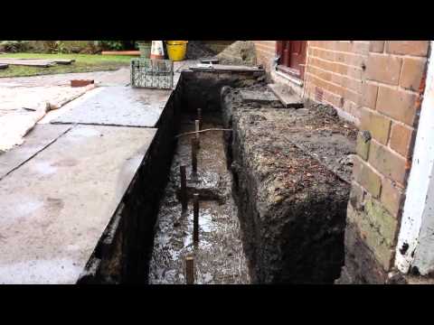 Part of a video titled How to level a concrete foundation for a house - YouTube