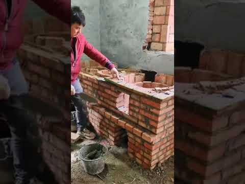 Building a wood-burning stove in rural China