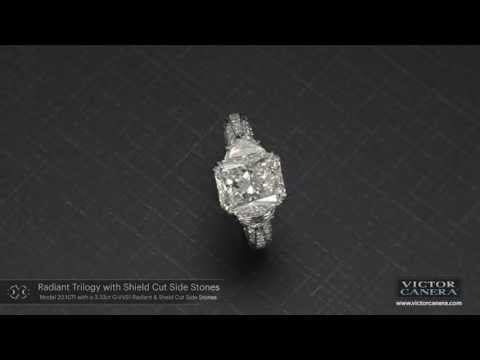 Three carat Radiant Trilogy ring with Shield Cut Side Stones