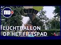 Buurtbewoners helpen luchtballon bij landing in Nijkerk | NU.nl