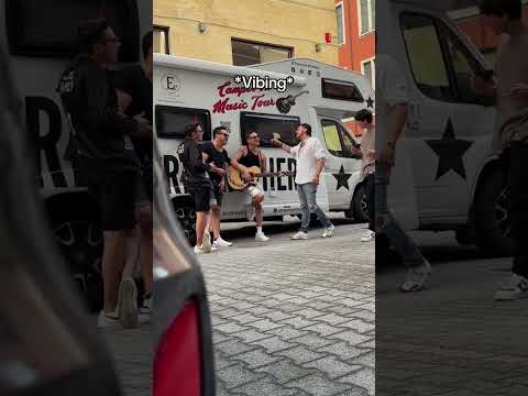 Breaking spaghetti in front of Italian band