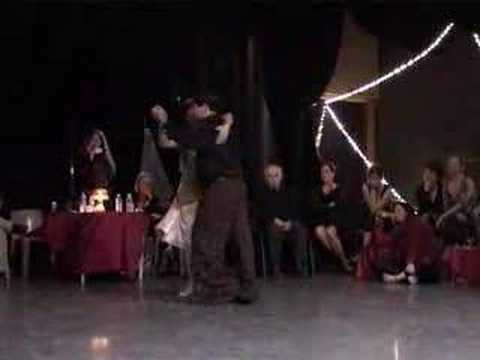  Carlos Espinoza  and  Mamié Sancy  are  dancing  to  the  milonga  "  La Cicatriz  "