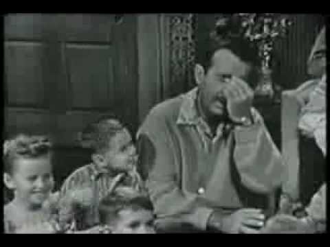 Ernie Ford - singing with a little boy by his side.  Pretty funny.