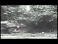 A US M5A1 Stuart Light Tank With A Hedge Cutter Runs Through A Hedge In Cerisy La HD Stock Footage