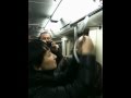 девушка в метро цепляет белые ленты 