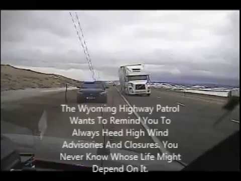 Wyoming wind gust blows semi truck on top of police car