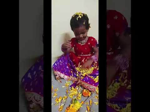 yashasri playing with flowers