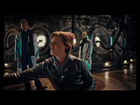 The Zero Theorem 2014 official trailer frame with Christoph Waltz’s Qohen bathed in neon