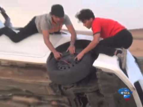 Arabian stunt drivers change tyres in the air