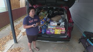 Denver woman handing out shelf-stable food along with Halloween candy