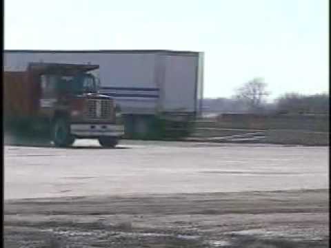 Experiment: What happens when a dump truck going 50mph hits a military-grade concrete barrier?