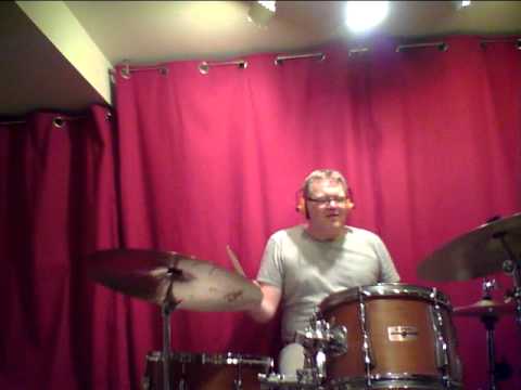 Left foot clave, four on the bass drum, ride cymbal pattern, Melody to "Cubano Chant" in left hand