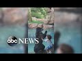 Bear and boy jump for joy