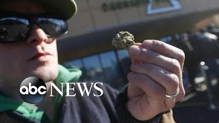 Thousands line up early in Canada to buy marijuana legally