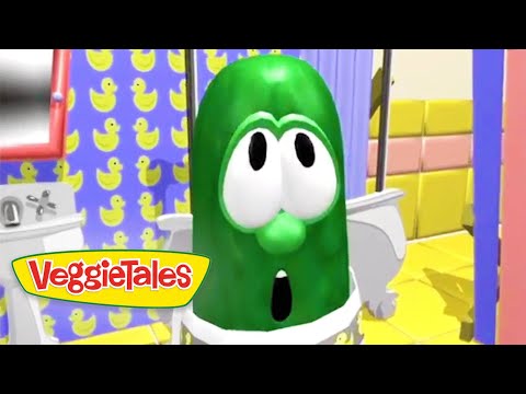 Green cartoon cucumber with big eyes and open mouth in a bright, colorful set; VeggieTales logo visible.