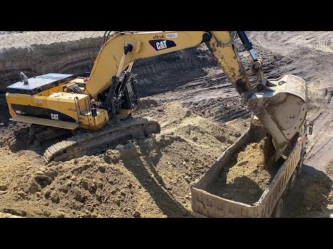Caterpillar 390D Excavator Loading Mercedes & MAN Trucks - Interkat SA