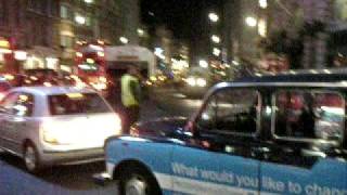 preview picture of video 'Men show Muscles - Piccadilly Circus London'