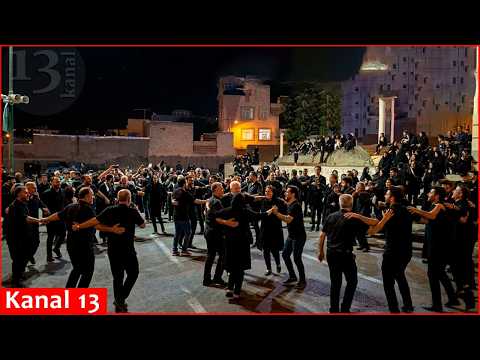 Iranians celebrate the death of Iran's supreme leader