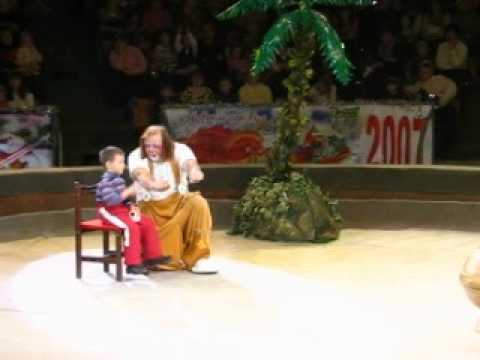Circus Clown and 5 year old kid performing an old magician's trick