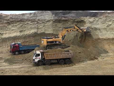 Caterpillar 385C Excavator Loading Mercedes And Man Trucks