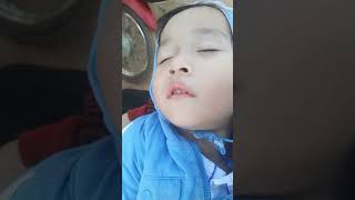 A kid sleeping when drive a motor