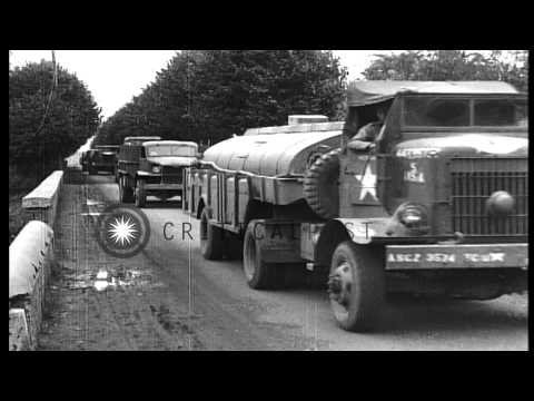 U.S. Army "Red Ball" Convoy passes through  village of Courville sur eure, France...HD Stock Footage