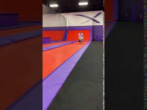 Guy does flips on trampoline, and lands and looks like he broke his legs.