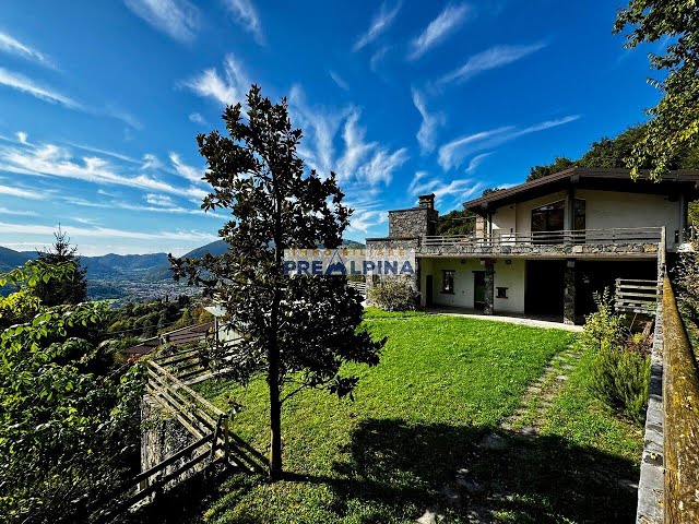Esclusiva Villa Panoramica con Vista Lago e Piscina Coperta