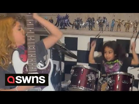 Young siblings rock out on drums and guitar - aged ten and eight | SWNS