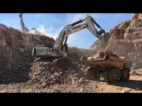 Liebherr 984 Excavator Loading Caterpillar Dumpers And Operator View - Sotiriadis Brothers