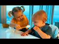Naomi feeding her brother