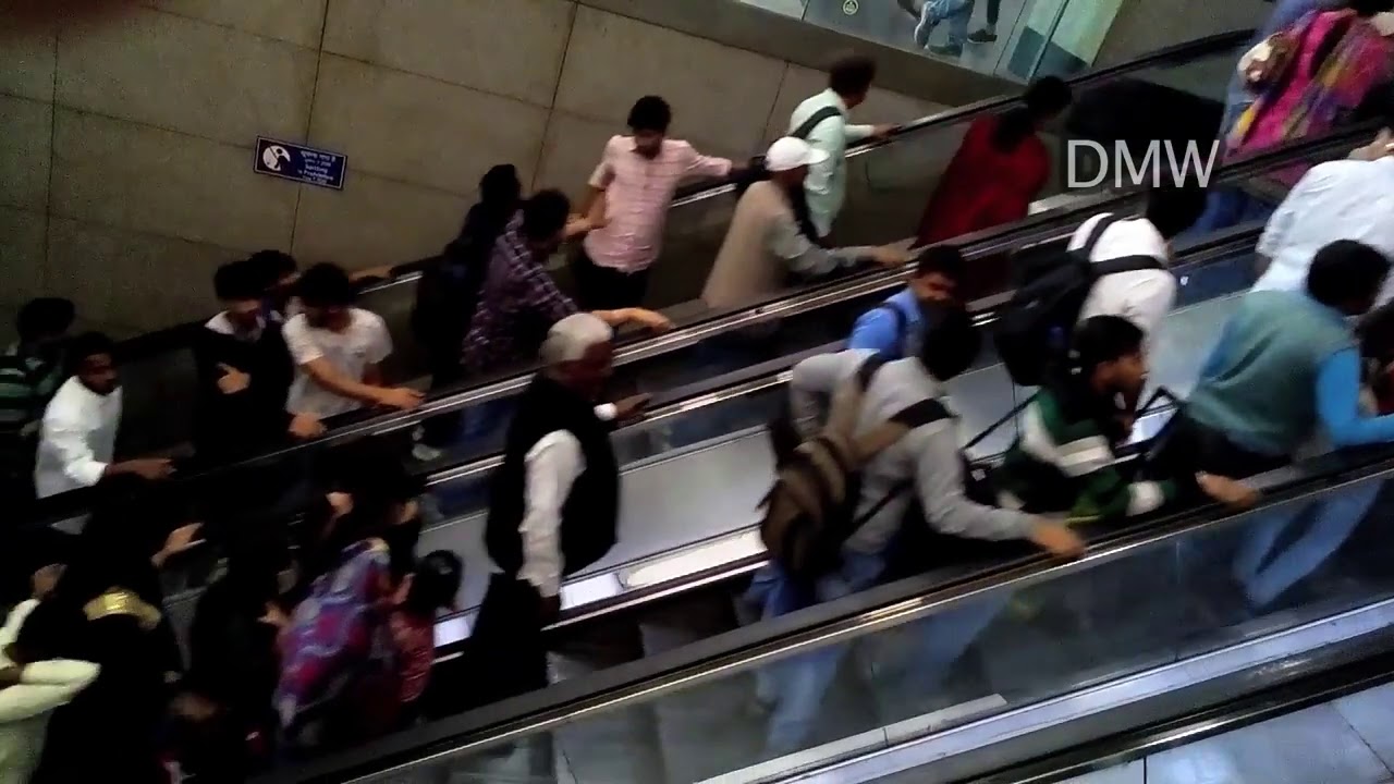 Metro Commuters on escalators in New Delhi