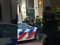 Arrestatie voortvluchtige Bretly D. op de Prins Hendrikkade
