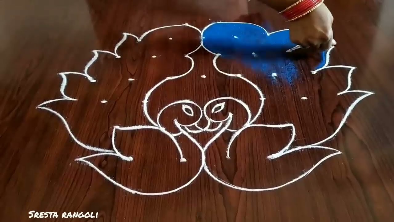 peacock rangoli design with 7 dots by sresta