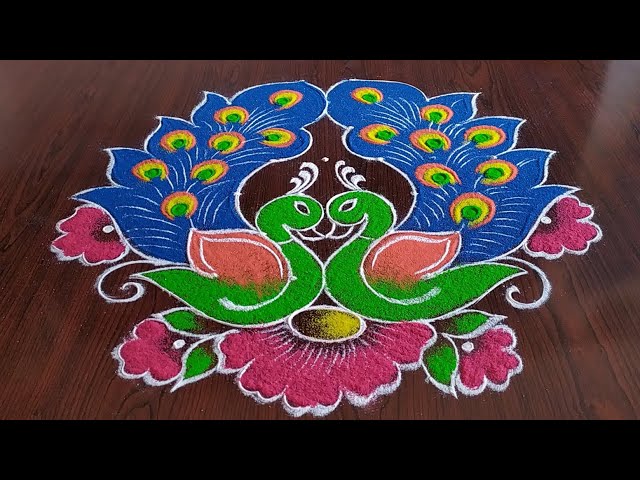 Peacock rangoli design with 7 dots by sresta
