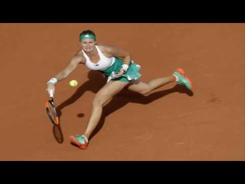 Muguruza advances as Mladenovic battles through pain barrier at French Open