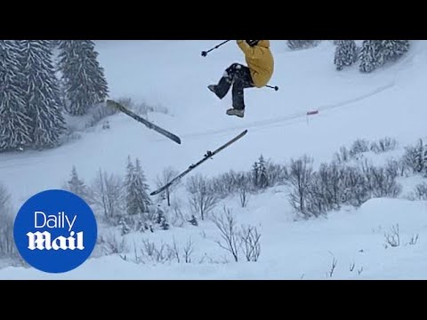 Nail-biting moment a skier is thrown into the air without skis
