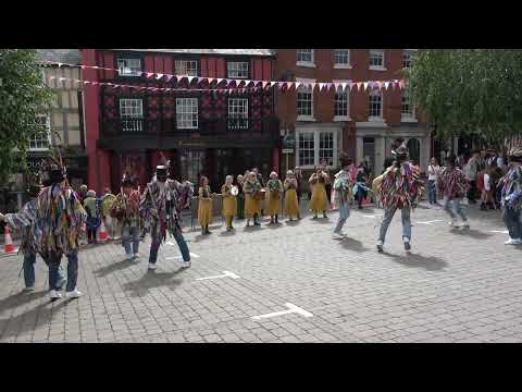 The Shropshire Bedlams dance "Four Lane End" in Market Square at Bromyard Folk Festival.