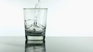FREEDIO: "Water pouring into glass slow motion" royalty free HD stock video footage