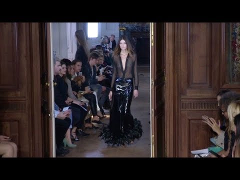 Models and designer on the runway for the Guy Laroche Fashion Show