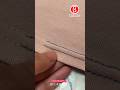 Repairing a loose seam or unraveling thread with a neat, invisible double backstitch.
